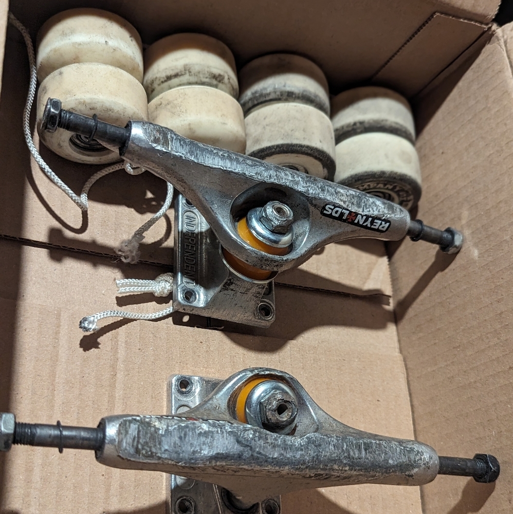 2 sets of wheels with bearings and 1 set of trucks